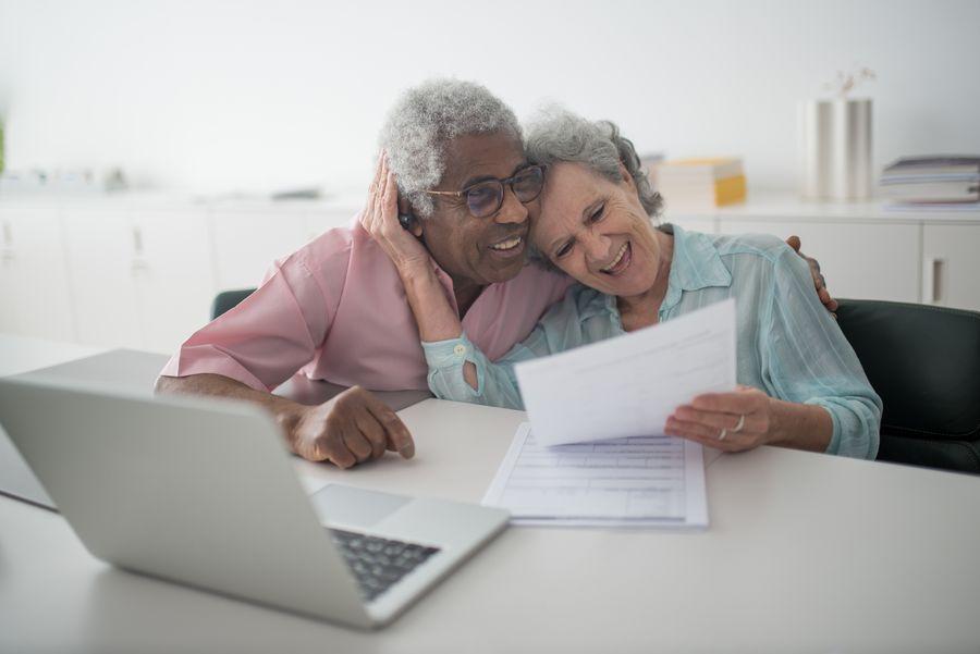 Senior couple reviewing retirement documents together